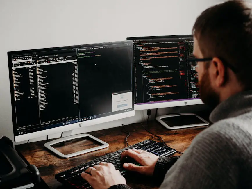 A developer working with multiple screens showing data streams and code